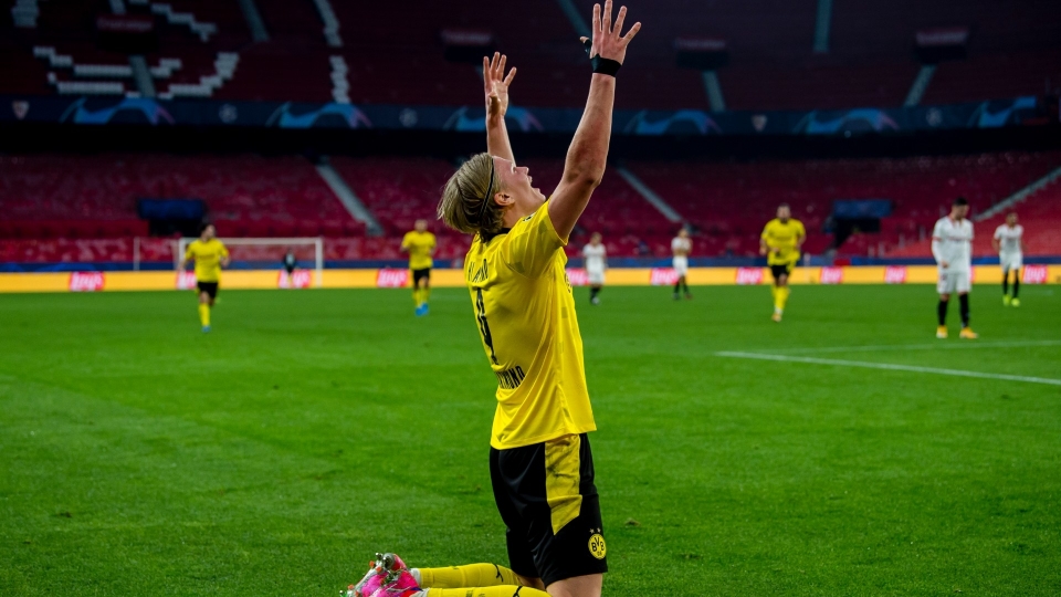 Borussia Dortmund striker Erling Haaland celebrates scoring a brace against Sevilla.