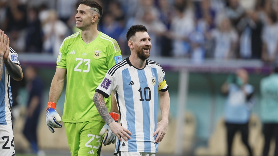 Emiliano Martinez and Lionel Messi