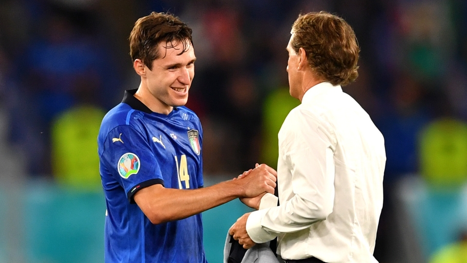 Federico Chiesa shakes hands with Roberto Mancini