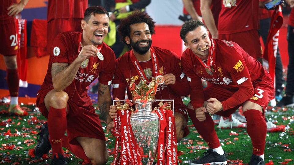 Liverpool lifts The Premier League trophy following the Premier League match between Liverpool FC and Chelsea FC at Anfield on July 22, 2020