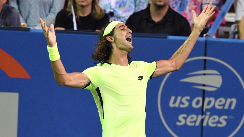 Lloyd Harris celebrates after beating Rafael Nadal