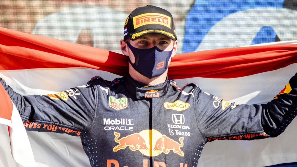 Max Verstappen celebrates with the Dutch flag at Zandvoort